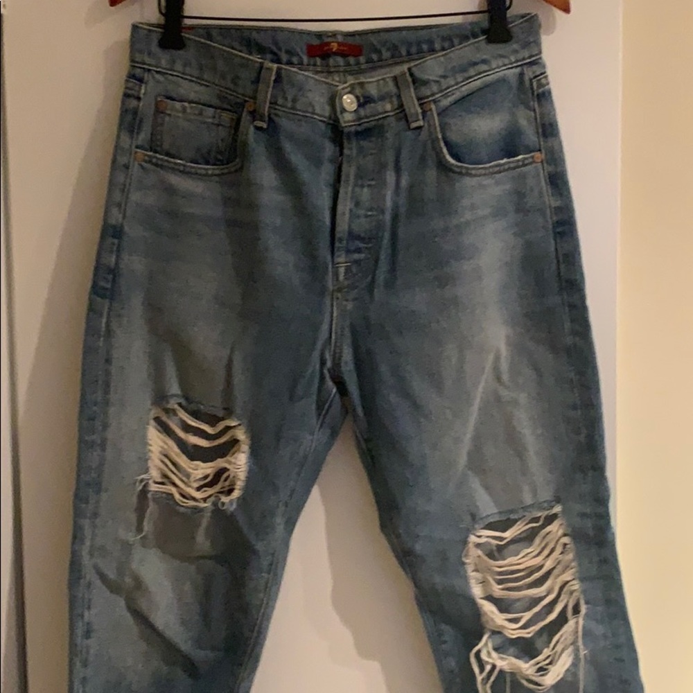 7 For All Mankind ripped wide leg jeans.